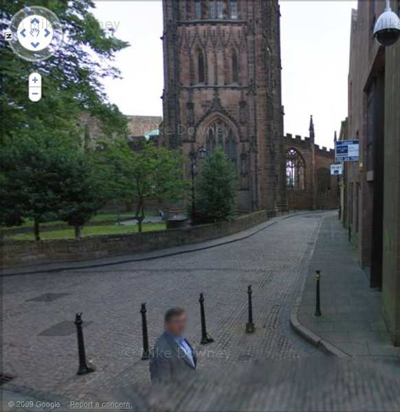 Google Street View: man buried in the pavement near Coventry Cathedral